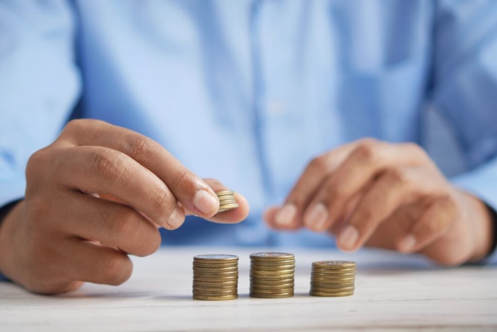 Stacking coins representing compound interest growth over time