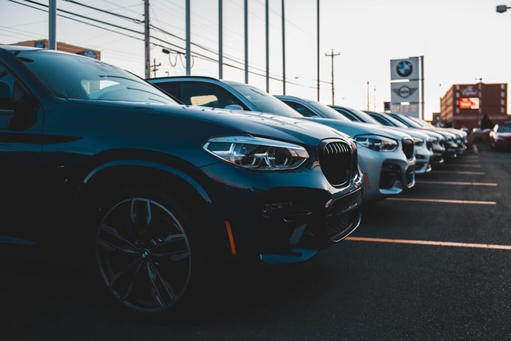 Cars at a dealership representing factors that affect your auto loan interest rate