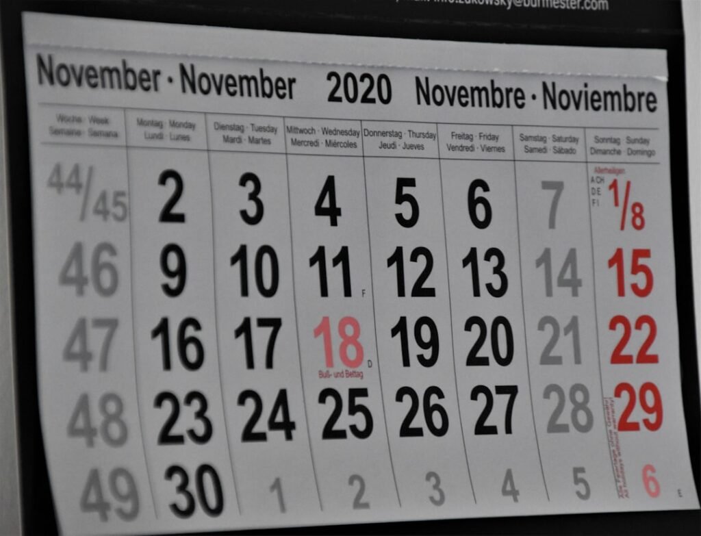 Wall calendar with marked dates representing calculating business days between dates