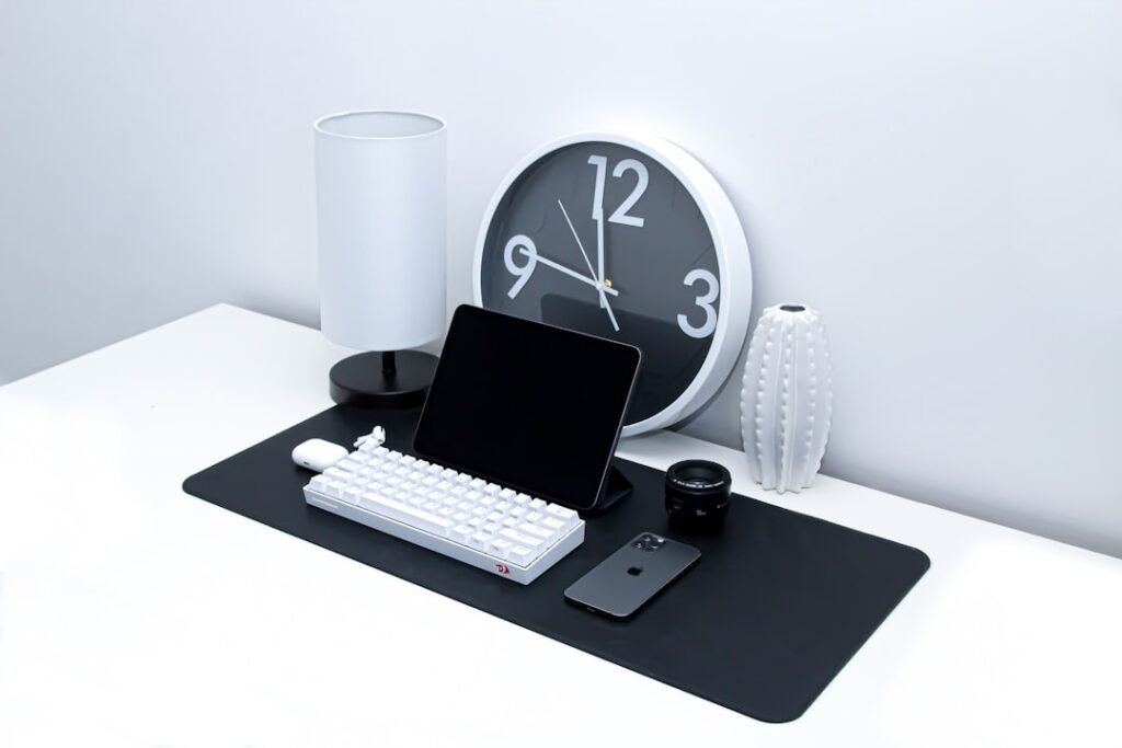 Office desk workspace representing converting work hours and minutes for payroll