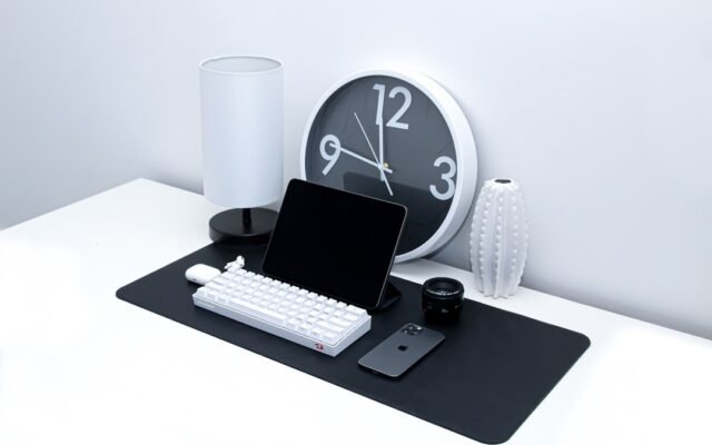 Office desk workspace representing converting work hours and minutes for payroll