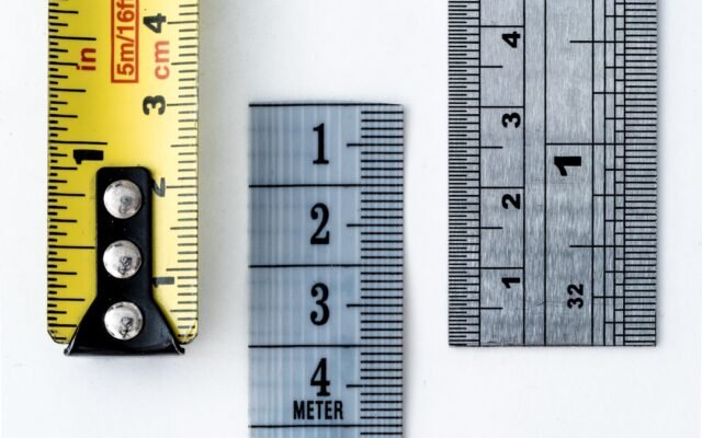 Rulers and measuring tapes representing unit conversion mistakes and precision