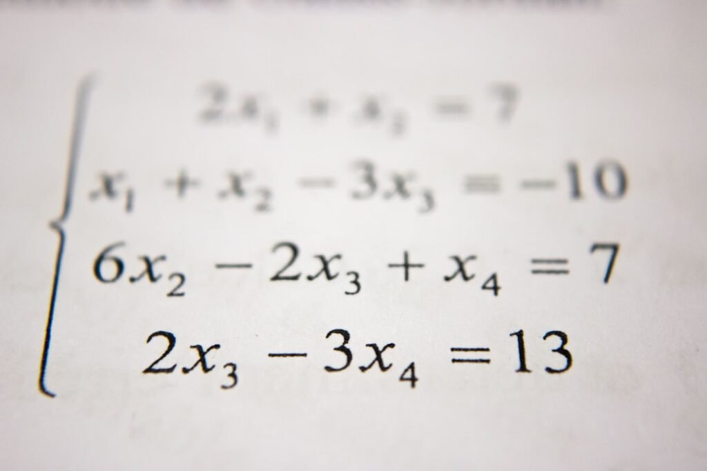 System of equations on paper representing common percentage calculation mistakes