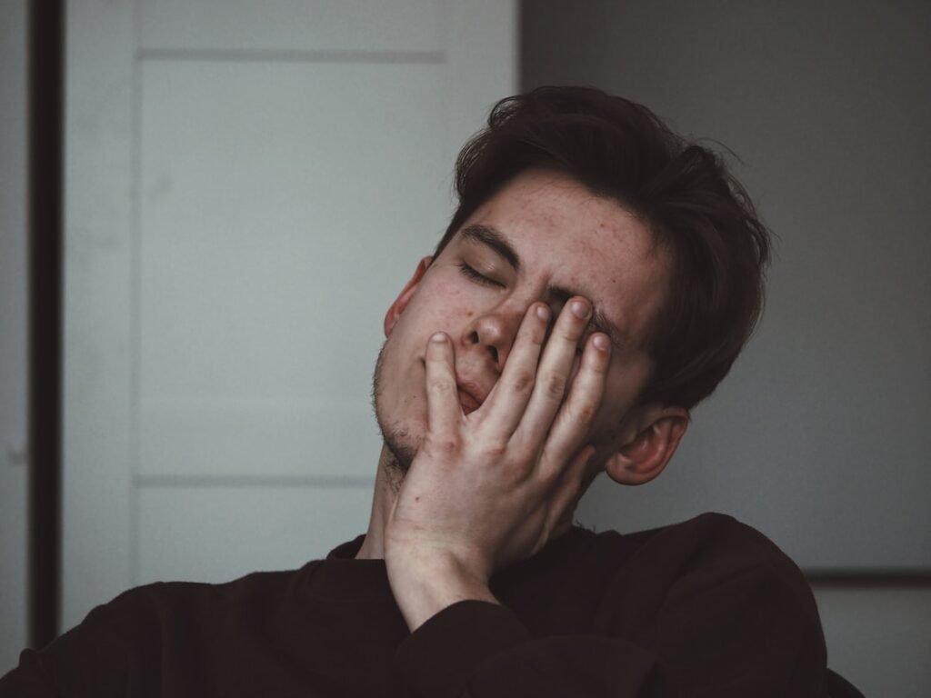 Person resting from fatigue representing signs of not eating enough calories