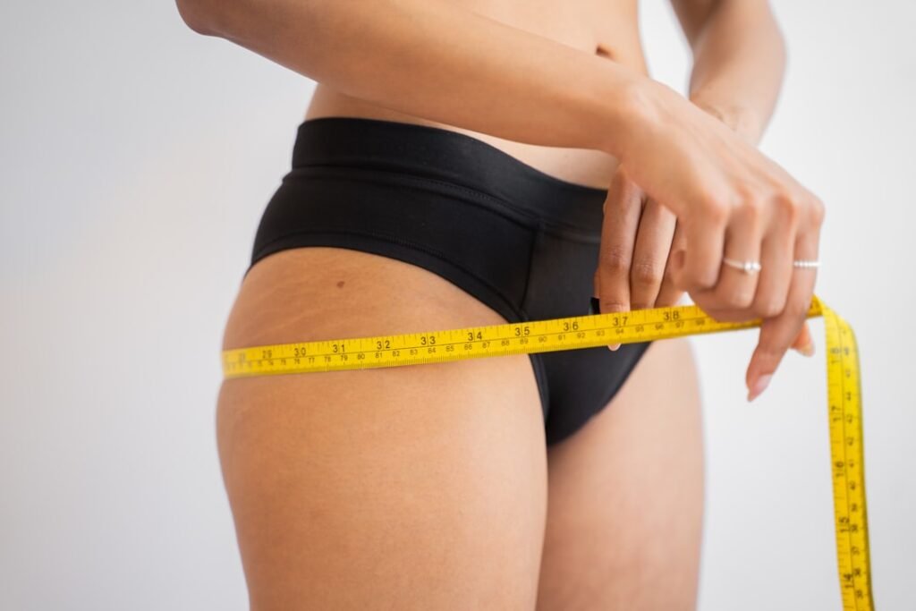 Measuring tape for hips representing visceral versus subcutaneous fat