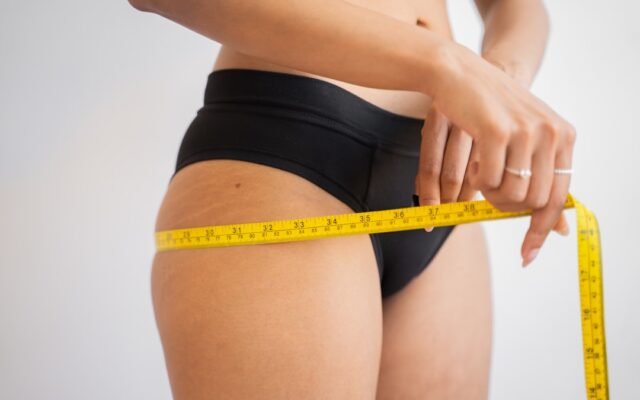 Measuring tape for hips representing visceral versus subcutaneous fat